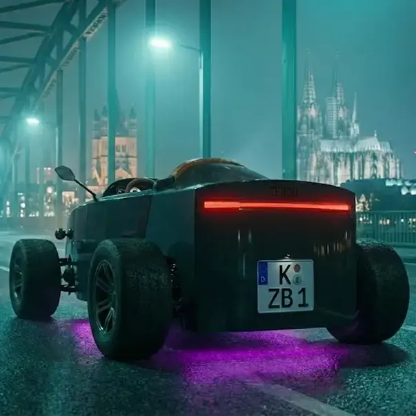 ZBROD rear three-quarter on wet asphalt with neon reflections